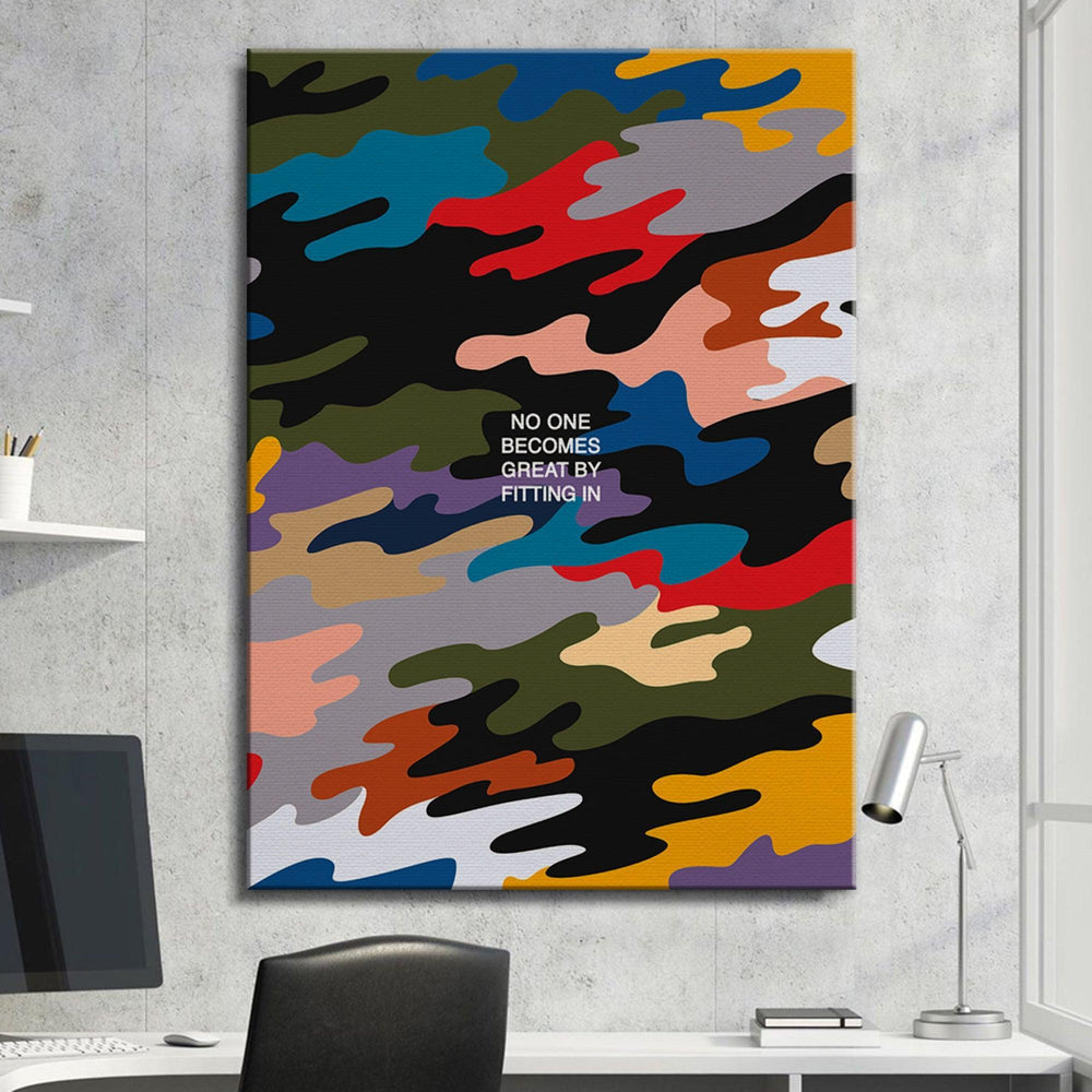 Motivational camouflage canvas wall art with 'No one becomes great by fitting in' quote in modern office.