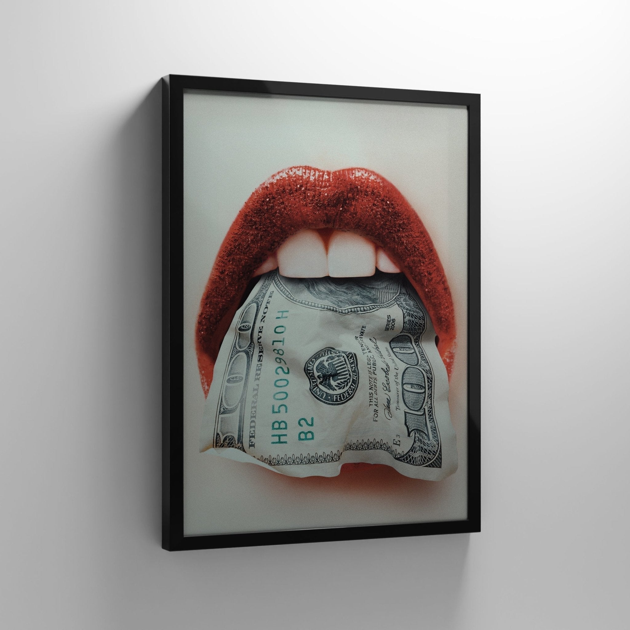 Framed IKONICK canvas wall art of red lips holding a US dollar bill, modern motivational decor.